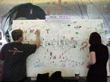 Attendees coloring the mural.